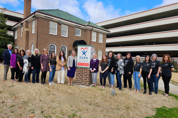 Child Advocates staff in front of building