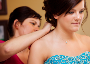 advocate helping a girl get ready for prom