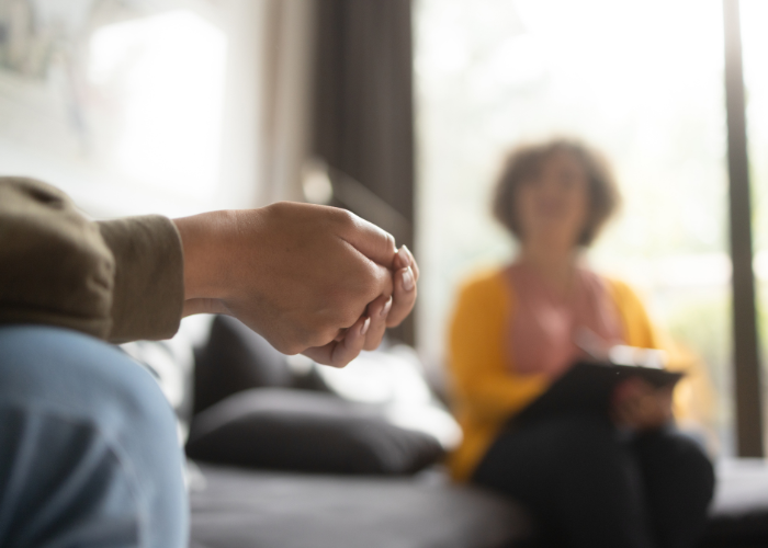woman talking to a teen