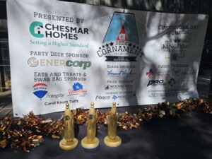 Photo of sponsor banner and trophies