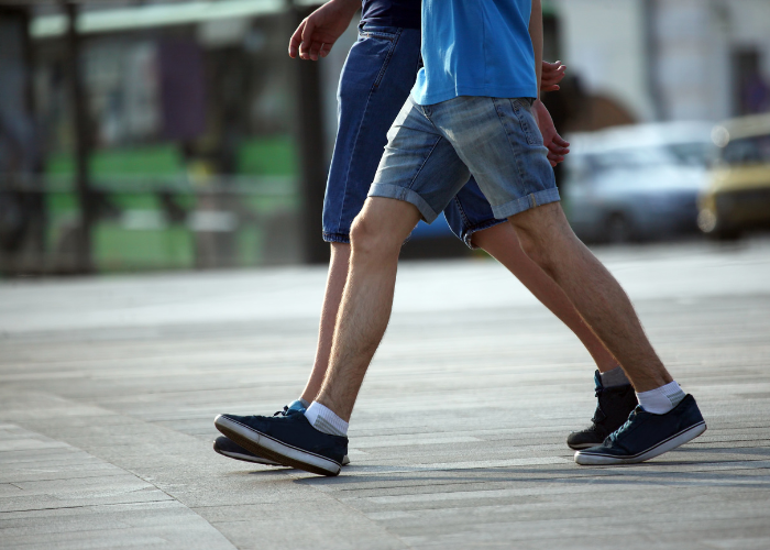 Man and a teen walking