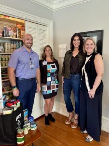 Waste Connections and H-E-B representatives celebrate pantry opening with CEO