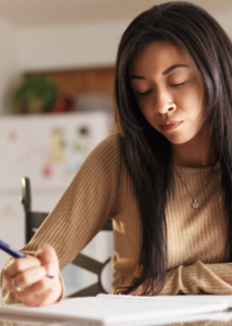 Teen girl in care drawing